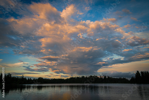 Sunset clouds over a rural lake