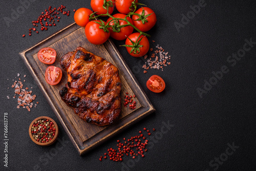 Fresh juicy delicious beef steak on a dark background