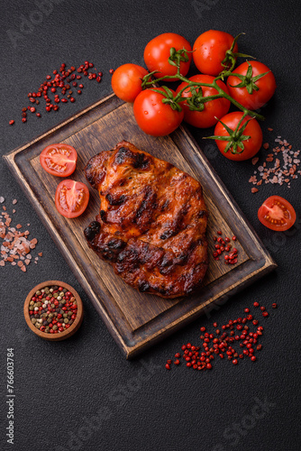 Fresh juicy delicious beef steak on a dark background