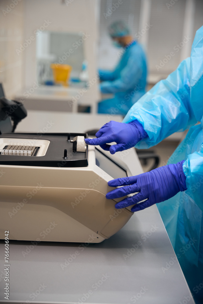 Laboratory assistant conducts research in a modern laboratory Laboratory assistant conducts research in a modern laboratory