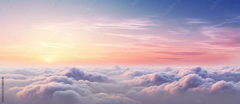 A serene aerial view captures the beauty of a sunset casting its golden hues over a vast expanse of fluffy clouds A serene aerial view captures the beauty of a sunset casting its golden hues over a vast expanse of fluffy clouds
