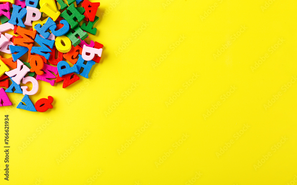 colored letters of the alphabet on a yellow background