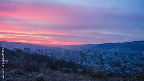 Sunrise cityscape of Tbilisi city. time lapse shot with slider photo