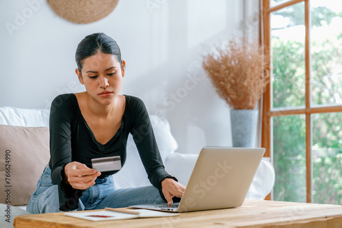 Stressed young woman has financial problems with credit card debt to pay uttermost show concept of bad personal money and mortgage pay management crisis.