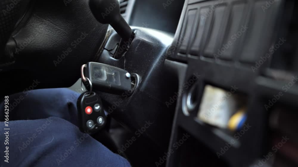  close-up of a woman's hand in knitted gloves puts the keys in the ignition of the car and starts it preparing the car for the trip woman driving
old cars