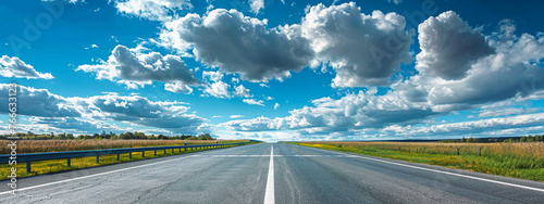 Isolation of straight highway road with clouds photo