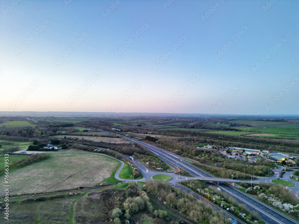 High Angle View of British Countryside and Village of Oxford Near M40 Motorways During Sunrise, England UK