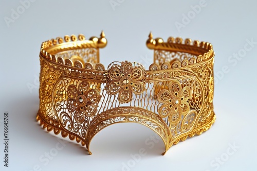 Opulent gold bracelet adorned with intricate filigree photo