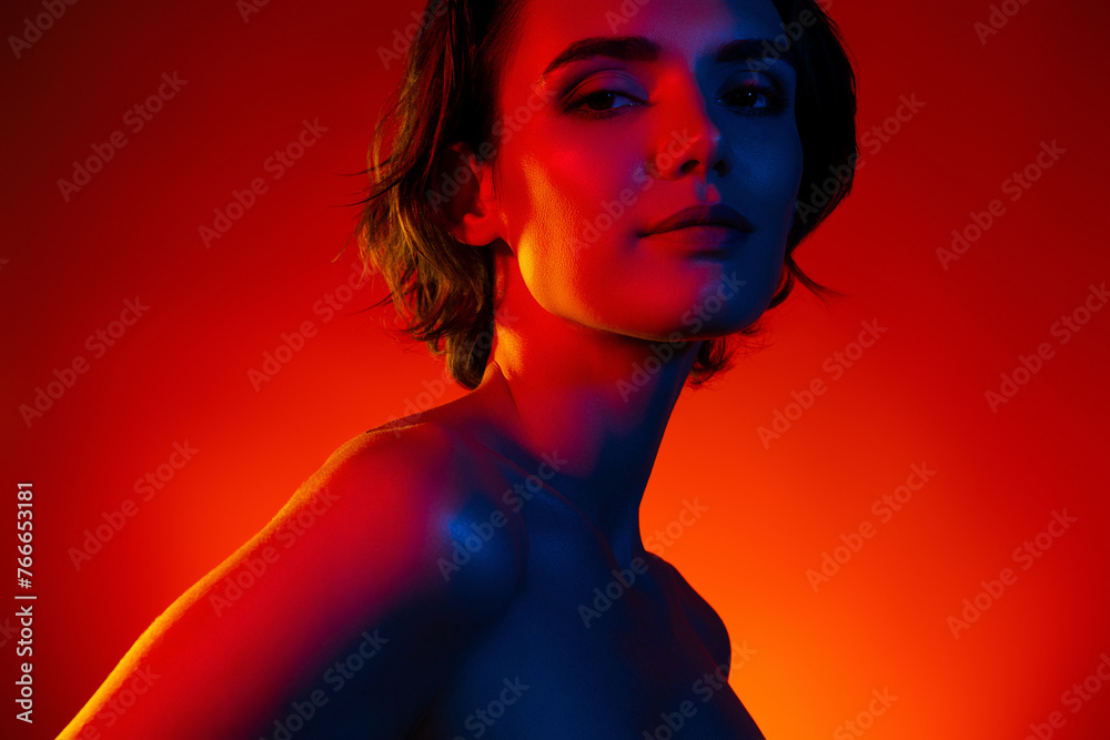 Photo of sweet adorable lady wear nothing enjoying skin care procedures isolated orange filter color background Photo of sweet adorable lady wear nothing enjoying skin care procedures isolated orange filter color background