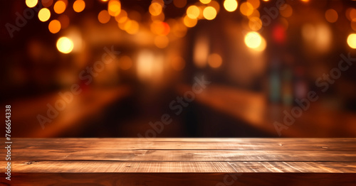 Old wooden table in dark blurred bar background. Copy space