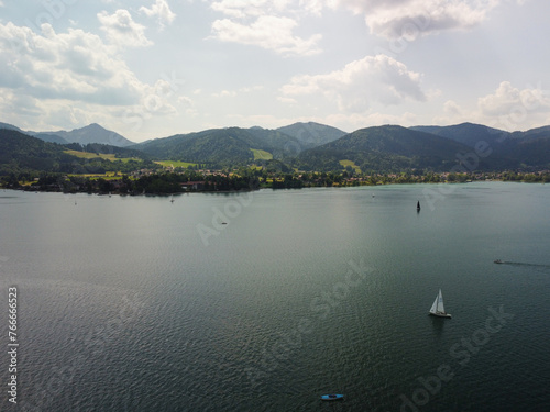 Panoramic view of deep blue Lake Lugano in Switzerland surrounded by mountains