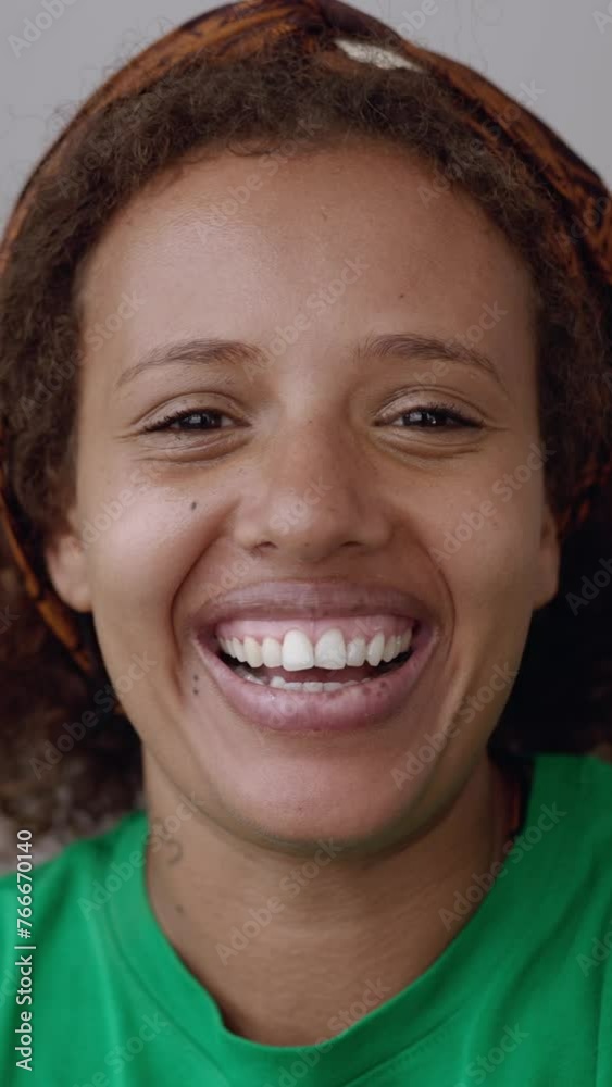 POV phone camera view of smiling young african american woman having a video call on smartphone app with friend. Mixed race millennial female talking on virtual meeting on cellphone. Vertical HD video POV phone camera view of smiling young african american woman having a video call on smartphone app with friend. Mixed race millennial female talking on virtual meeting on cellphone. Vertical HD video