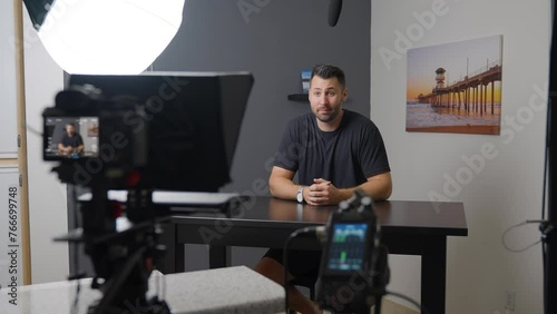 Man vlogging behind the scenes