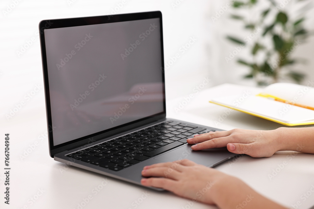 E-learning. Girl using laptop during online lesson at table indoors, closeup - obrazy, fototapety, plakaty 
