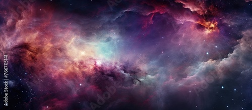 An image depicting a vivid nebula filled with bright colors and twinkling stars set against a deep blue sky