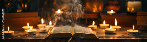 A spiritual arrangement of candles and incense with a bible as the focal point