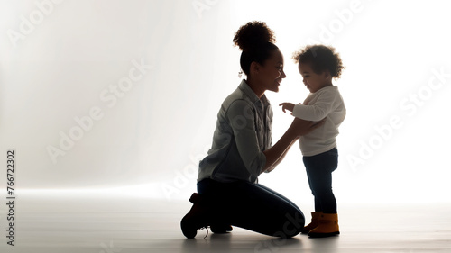 Dia das Mães: Mulher negra abraçando seu filho nesta data especial. Uso: design, propaganda, publicidade, celebração da maternidade e diversidade. photo