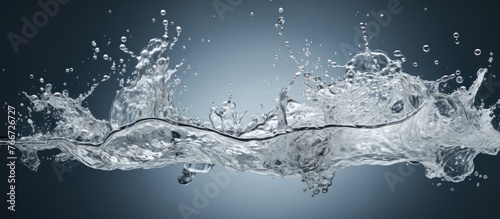 The image features a detailed close-up of a water splash set against a black background, creating a striking and dramatic effect