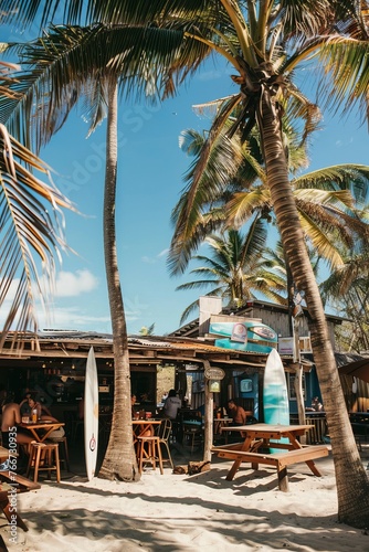 A beachside cafe with palm trees swaying in the breeze, surfboards propped up against the walls, and patrons enjoying smoothies and salads, Generative AI