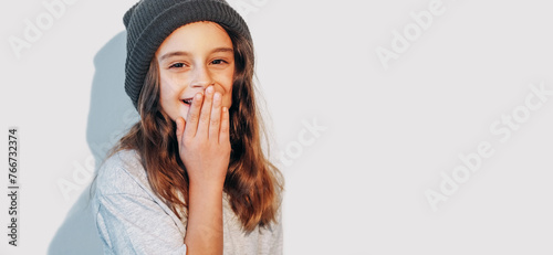 Amused child laughing kid joyful cute little girl