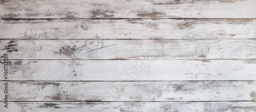 Detailed view of a wooden wall painted in white color, juxtaposed with a wooden floor