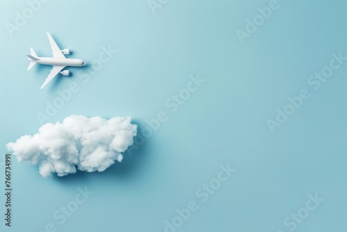 Model airplane with clouds on blue background.