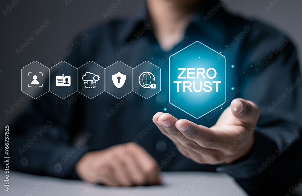 Naklejka premium Zero trust security concept, Businessman holding zero trust icon on virtual screen for business information security network.