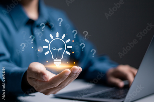 Question mark concept. Problem and solution. Quiz, test, survey, support, knowledge, decision. Businessman holding light bulb with question mark icon on virtual screen for FAQ. photo