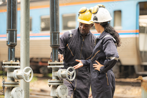 Railway technicians and engineers inspect is being done on the railway's oil and gas distribution system in main train station platform
