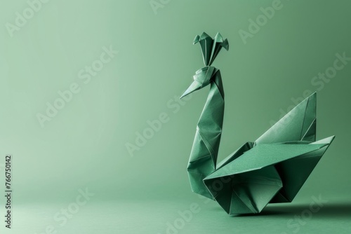 origami Peacock on pastel green background photo