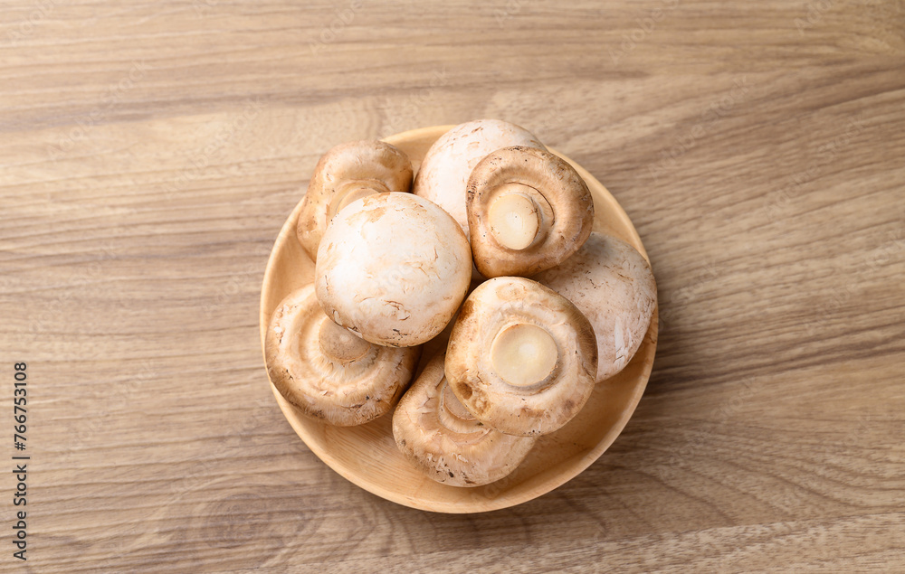 Fresh Champignon mushroom on wooden background, Table top view Fresh Champignon mushroom on wooden background, Table top view