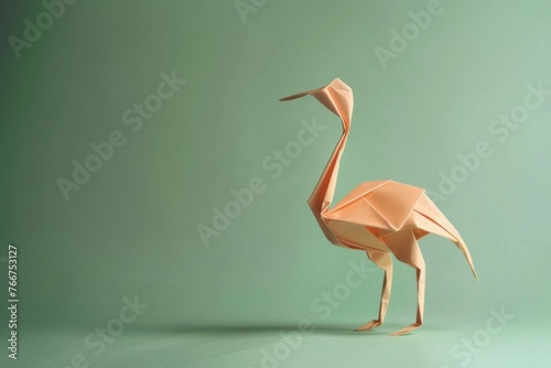 origami Ostrich on pastel green background photo