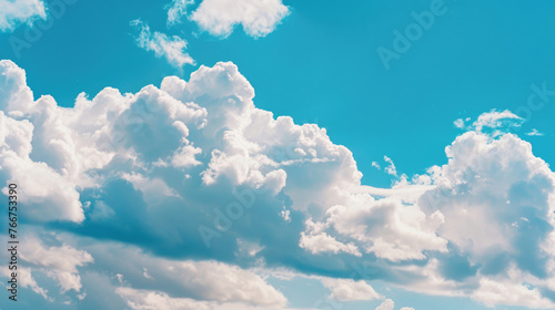 Large white clouds against a blue sky background