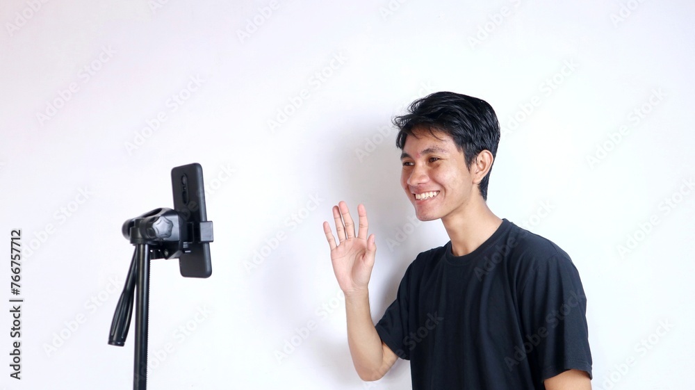 the activities of young Asian men doing live streaming using smartphone the activities of young Asian men doing live streaming using smartphone