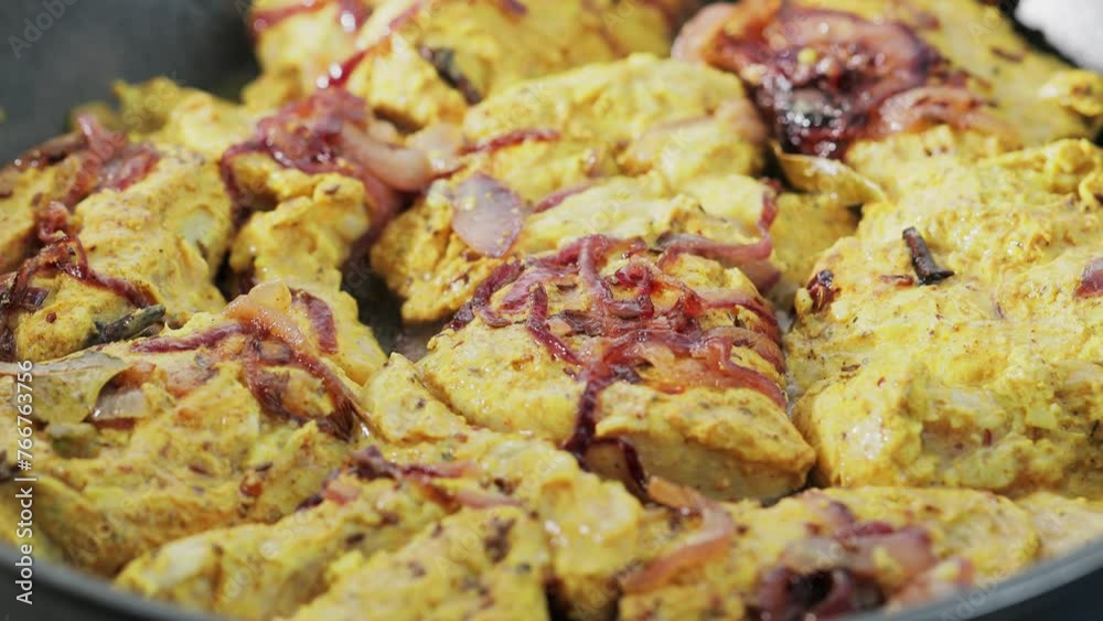 Chicken Biryani Preparation with Marinated Meat and Onions in Frying Pan, Close-Up Shot Chicken Biryani Preparation with Marinated Meat and Onions in Frying Pan, Close-Up Shot