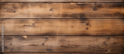 Wooden wall captured up close displaying a rich brown stain, adding warmth and texture to the surface