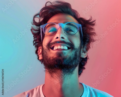 portrait of modern pakistan man smiling in round blue glasses on light red and light blue gradient background in the style of photorealistic, elegant