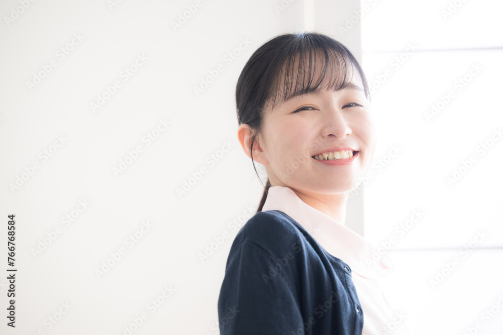 Positive image of a young female nurse changing careers or being hired by the camera Close-up Positive image of a young female nurse changing careers or being hired by the camera Close-up