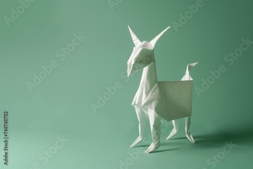 origami Goat on pastel green background photo