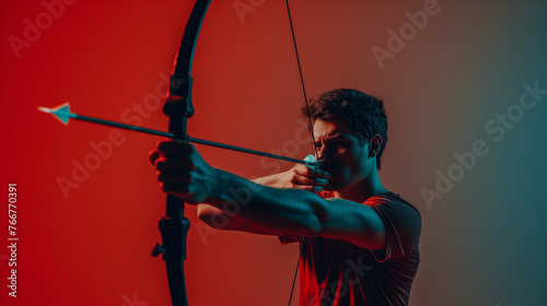 A professional athlete practicing precision archery on Coral color background professional photography