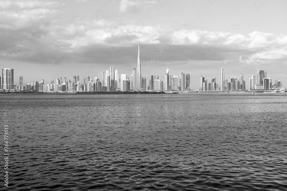 view of Dubai Downtown cityline from Dubai Creek Canal, black and white