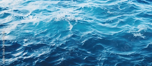 Capture a close-up shot of a tranquil body of water showing subtle waves and a serene atmosphere