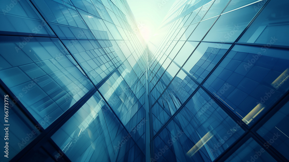 Fototapeta premium A majestic skyscraper rises into the sky, covered in countless shining windows that reflect the surrounding landscape