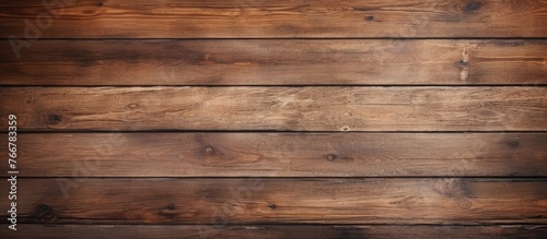 A detailed view of an aged wooden wall with a rich dark brown stain, showcasing the texture and color variation