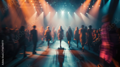 An abstract view of a fashion show with blurred figures under the dramatic lighting, capturing the industry's vibrant energy photo