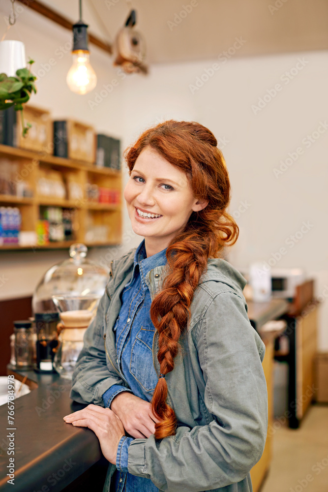 Woman, smile and portrait in morning at cafe with confidence, pride and waiting for drink at counter. Girl, person and happy customer at trendy coffee shop for cappuccino, latte or espresso in Italy