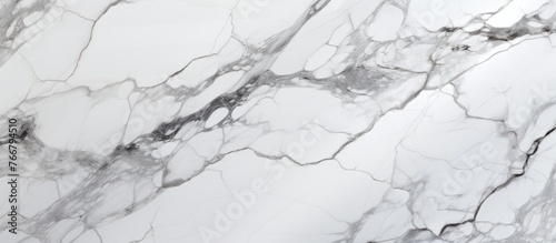 A closeup of a white marble texture resembling liquid snow on a slope. The pattern is reminiscent of monochrome photography, capturing the freezing event