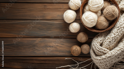 Balls of woolen thread in a basket on a wooden table, copy sospace