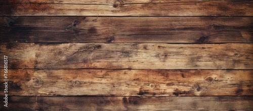 Close up view of a wooden wall featuring a rich brown stain finish, highlighting the natural texture and color variations