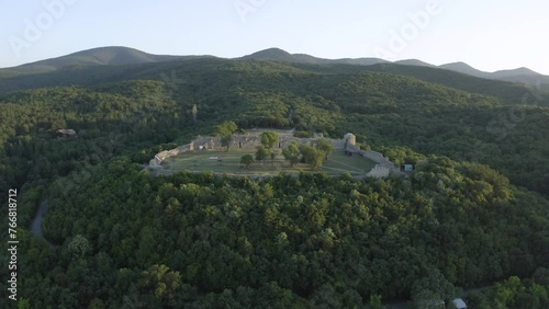 Medieval Fortress Surrounded By Lush Forests Near Mezek Village In Bulgaria. Aerial Drone Shot photo